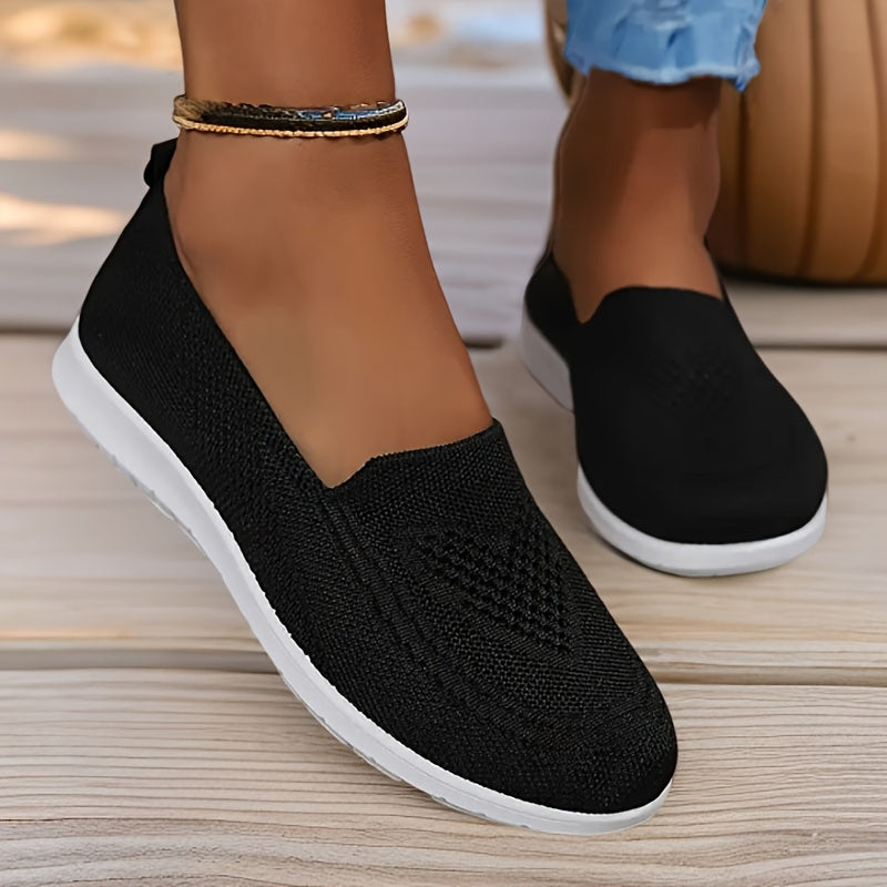 Schwarze Damen-Slip-On-Sneaker mit weißer Sohle, atmungsaktivem Strickmaterial und sportlich-elegantem Design