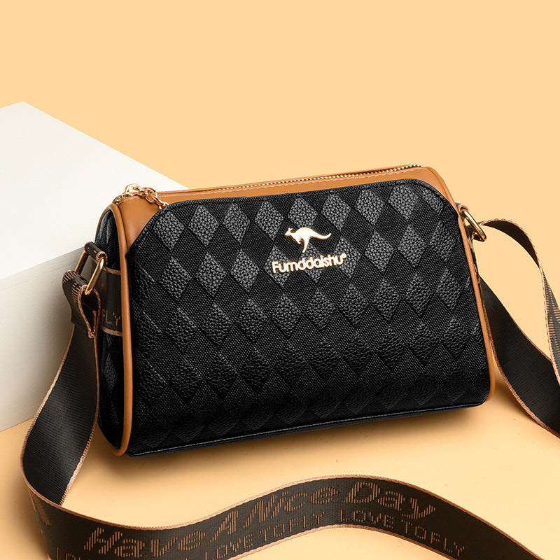 Luxus Umhängetasche schwarz mit Rautenmuster – elegante Crossbody Bag mit braunen Lederdetails und verstellbarem Schulterriemen für Damen